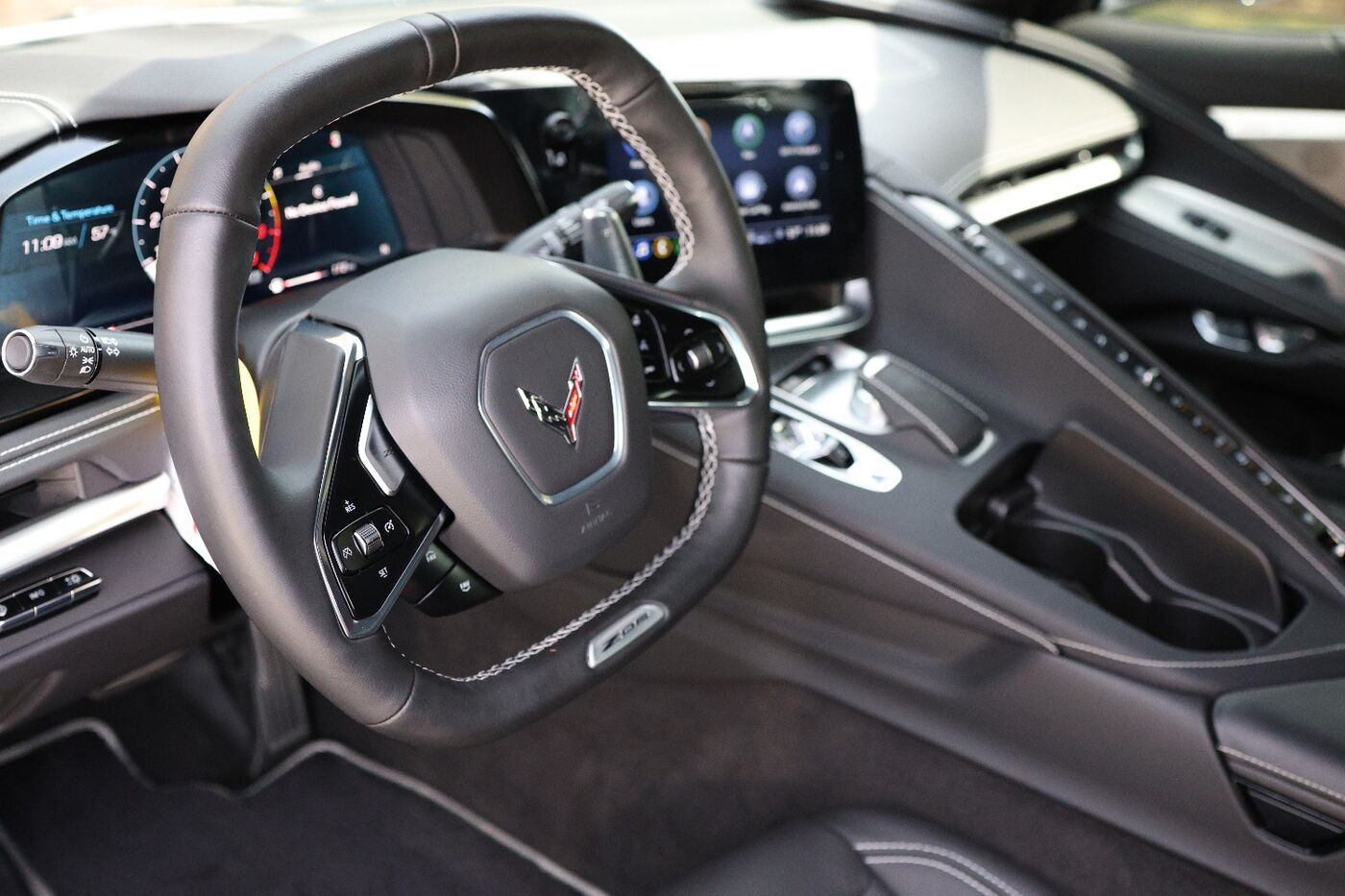 Spotless Corvette interior with steering wheel, center console and carpets after an interior detail